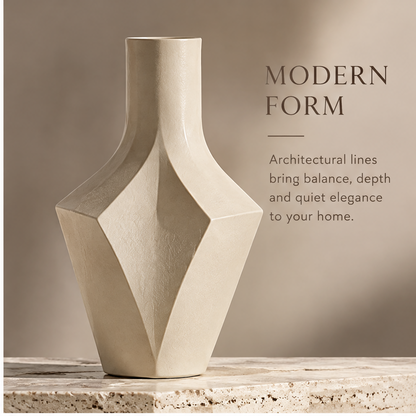 FORMIQI diamond-facet vase modern form view on travertine surface in warm light